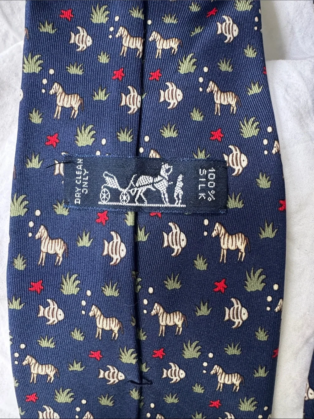 Hermès, navy silk necktie with fish and zebras and starfish MINT